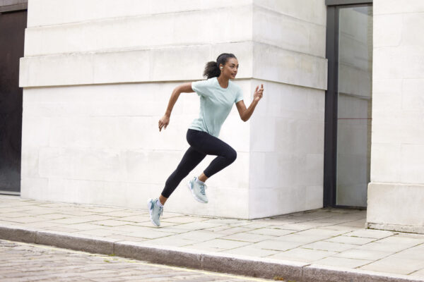 Jabra Elite 7 Active Mint Lifestyle Female Street Run Side Angle Medium