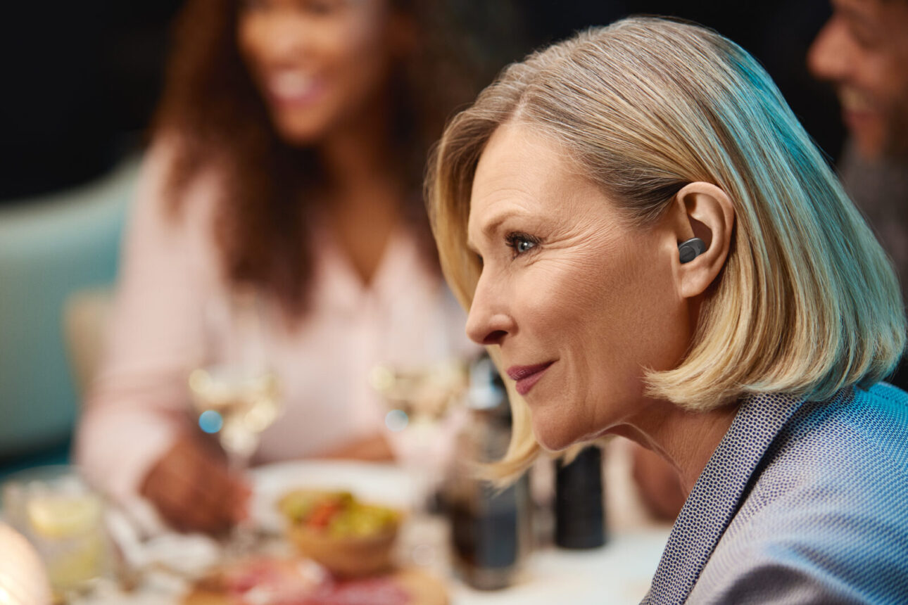 Jabra Enhance Plus Dark Grey Lifestyle Restaurant 2 v2 Medium
