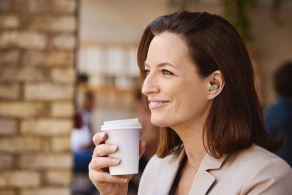 Jabra Enhance Plus Gold Beige Lifestyle Coffee Shop Medium